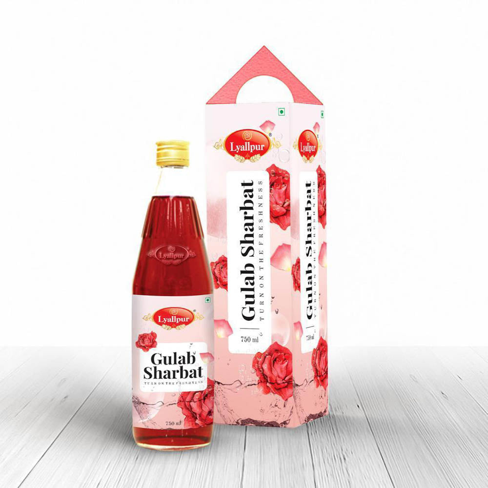 A bottle of rose-flavored syrup alongside a box, emphasizing the syrup's rich color and the box's stylish appearance.
